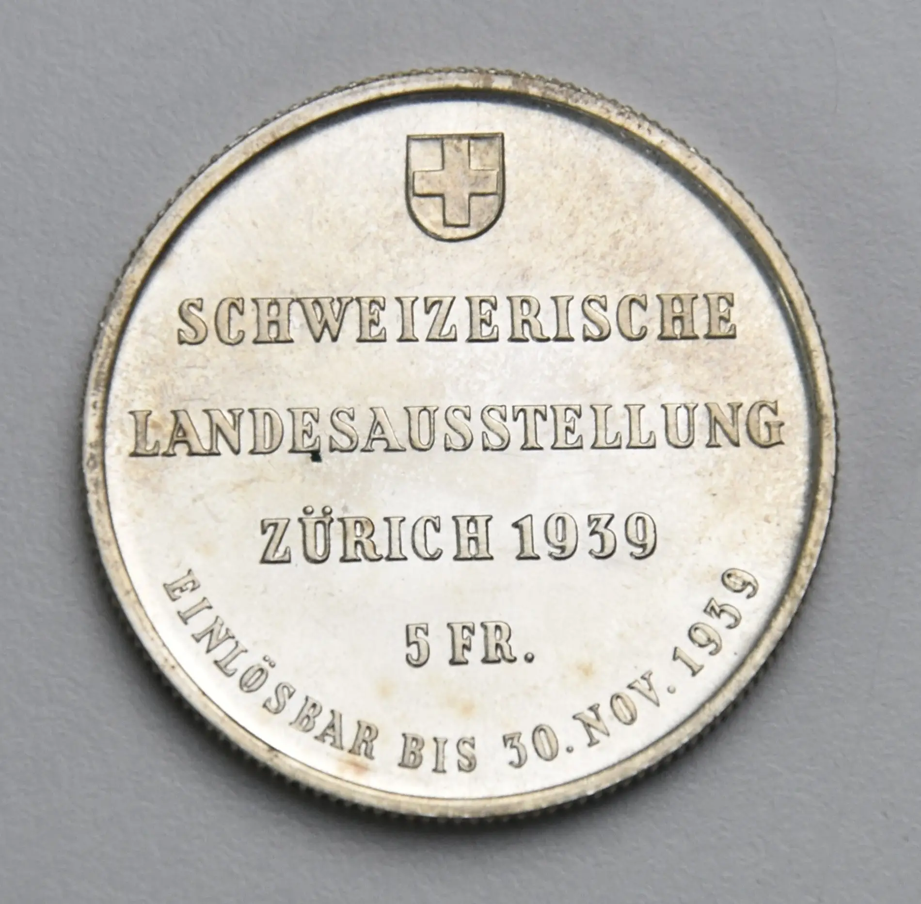 Schweizer 5 Franken Silbermünze zur Landesausstellung Zürich 1939 mit Ausstellungsinschrift.